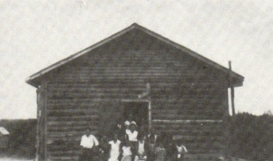 Delaronde School - also used as the church. H.S. Blezard and congregation - 1935.