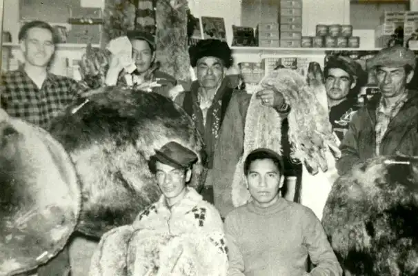 Tom Natomagan of Pinehouse selling furs to Ron Clancy