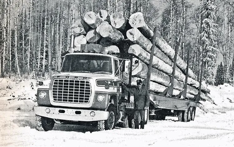 Truck hauling logs.