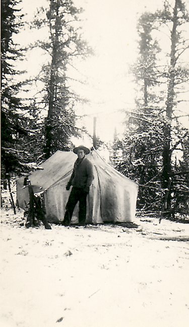 Fred in front of his tent camp