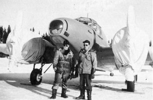 Rene Baudais (right) with engineer John Sinclair at Beaver Lake, 1948. Canvas covers on the propellor and motors are lashed down for an overnight stop in winter weather..