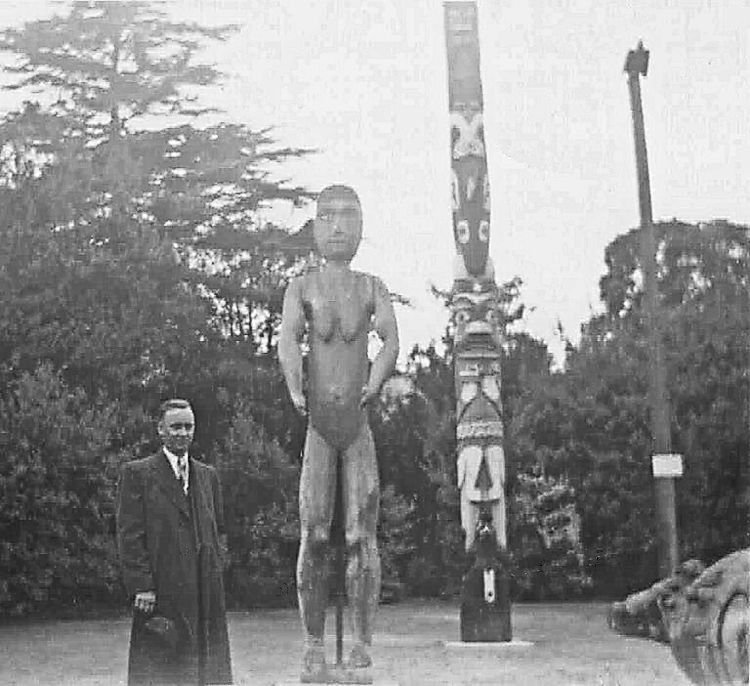 Ronnie posing with totem poles in B.C. - the mid-1950s.