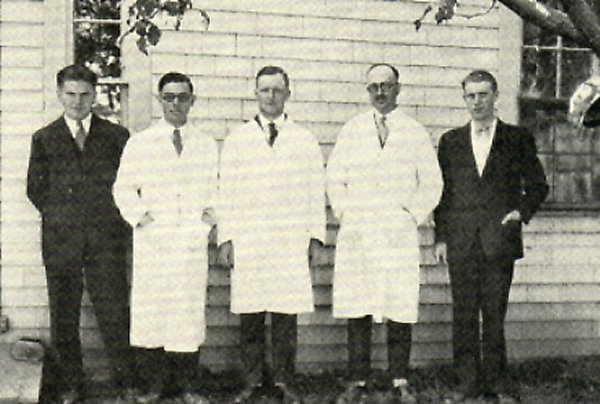 The only privately owned veterinary practice dealing with fur-bearing animals. It was in existence from the middle twenties to the middle thirties. The staff of Dr. Cunningham's Laboratory, Summerside, P.E.I. left to right: Edward Arnett, A. H. Kennedy, A. A. Kingscote, J. R. Cunningham and Rendle Bowness.